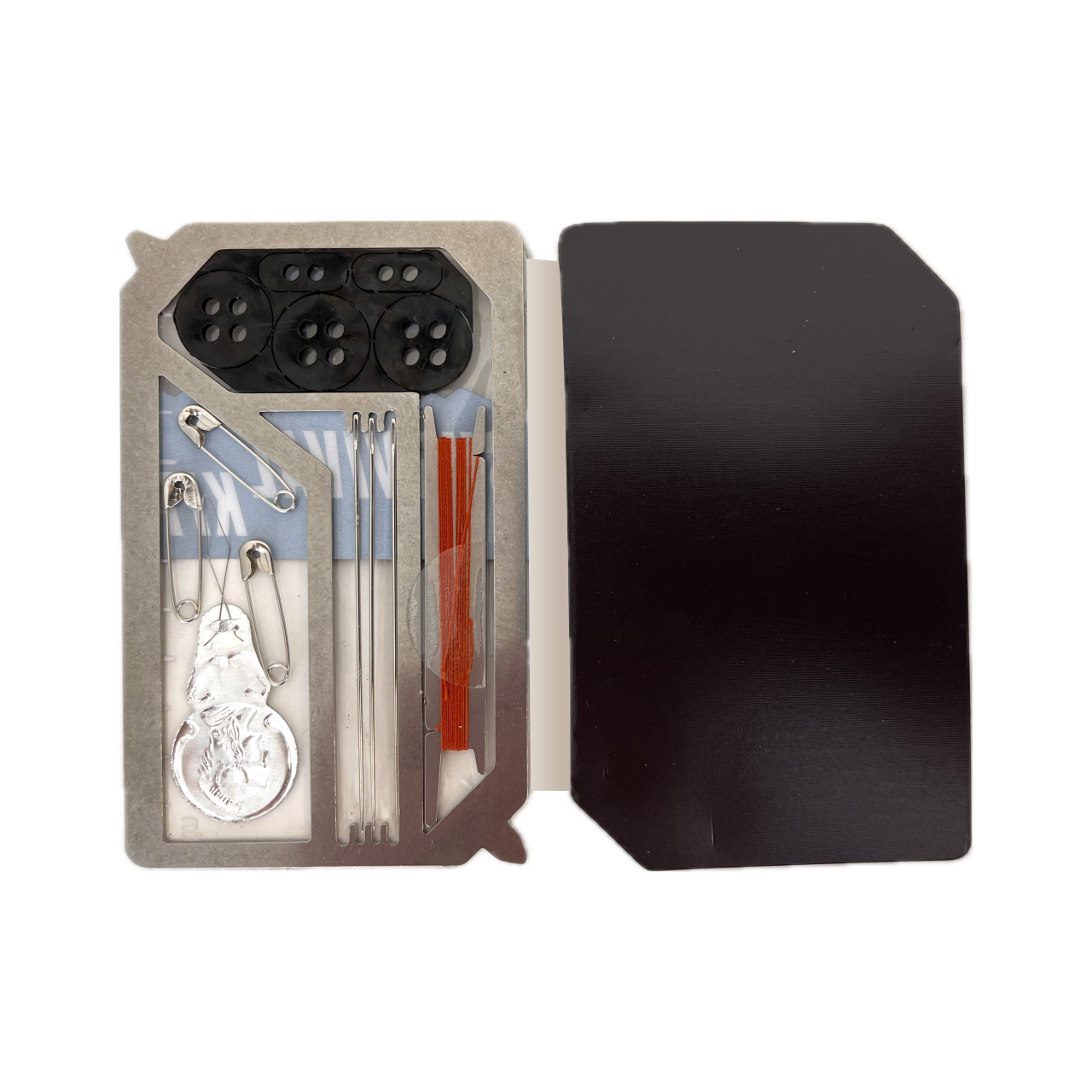 Sewing Survival Kit product image of open magnetic case, showing needles, thread, replacement buttons, threading tool, safety pins, screwdrivers, and ruler.