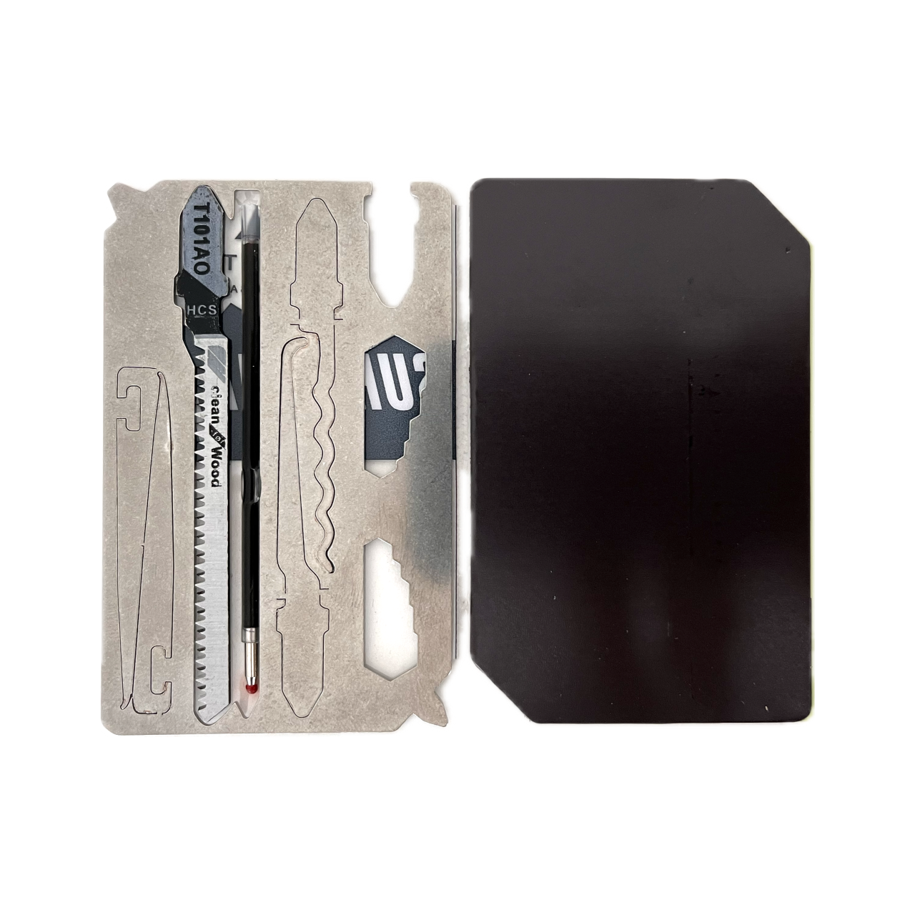 Urban Survival Kit magnetic case open, showing lock pick, metal cutting saw blade, ballpoint pen, tweezers, hex wrenches, screw drivers, and ruler.